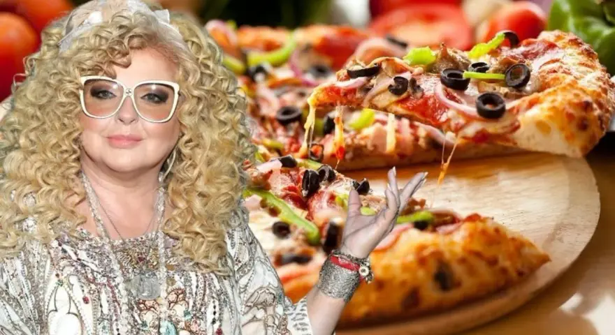 Magda Gessler prezentuje pyszną pizzę z ciągnącym się serem.